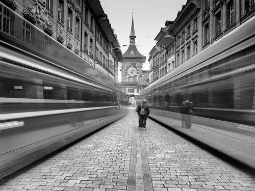 Long exposure of tram passing through old European street