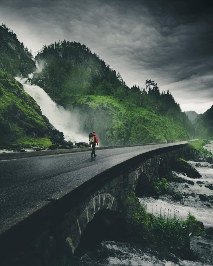 Dramatic mountain road with moody clouds